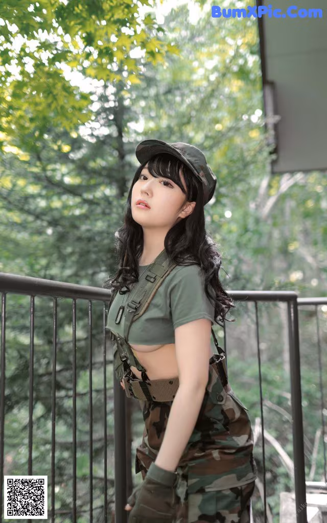 A woman in a military uniform posing for a picture.