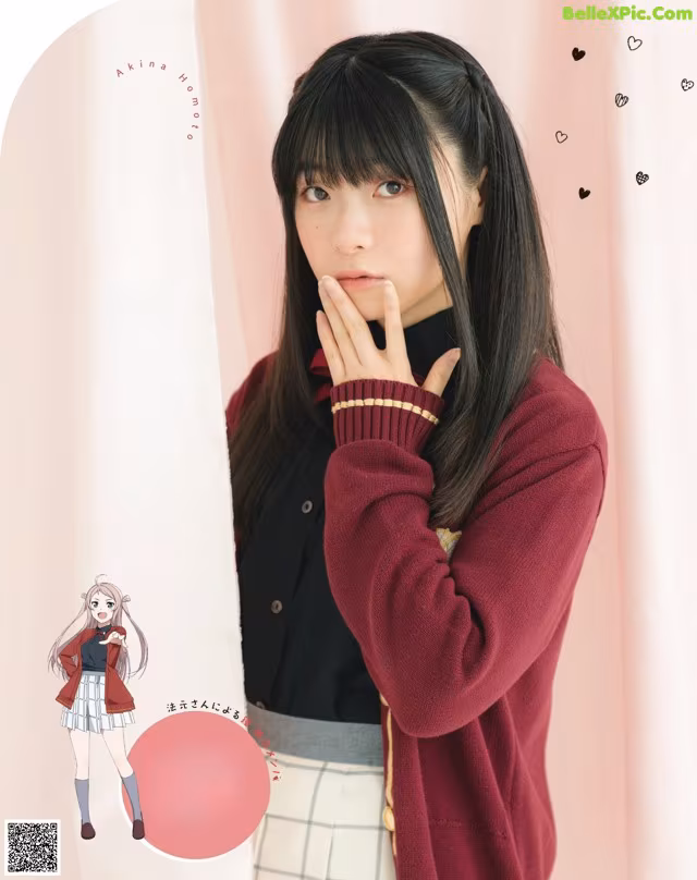 A woman with long black hair wearing a red sweater.