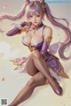 A woman with long purple hair sitting on the ground.